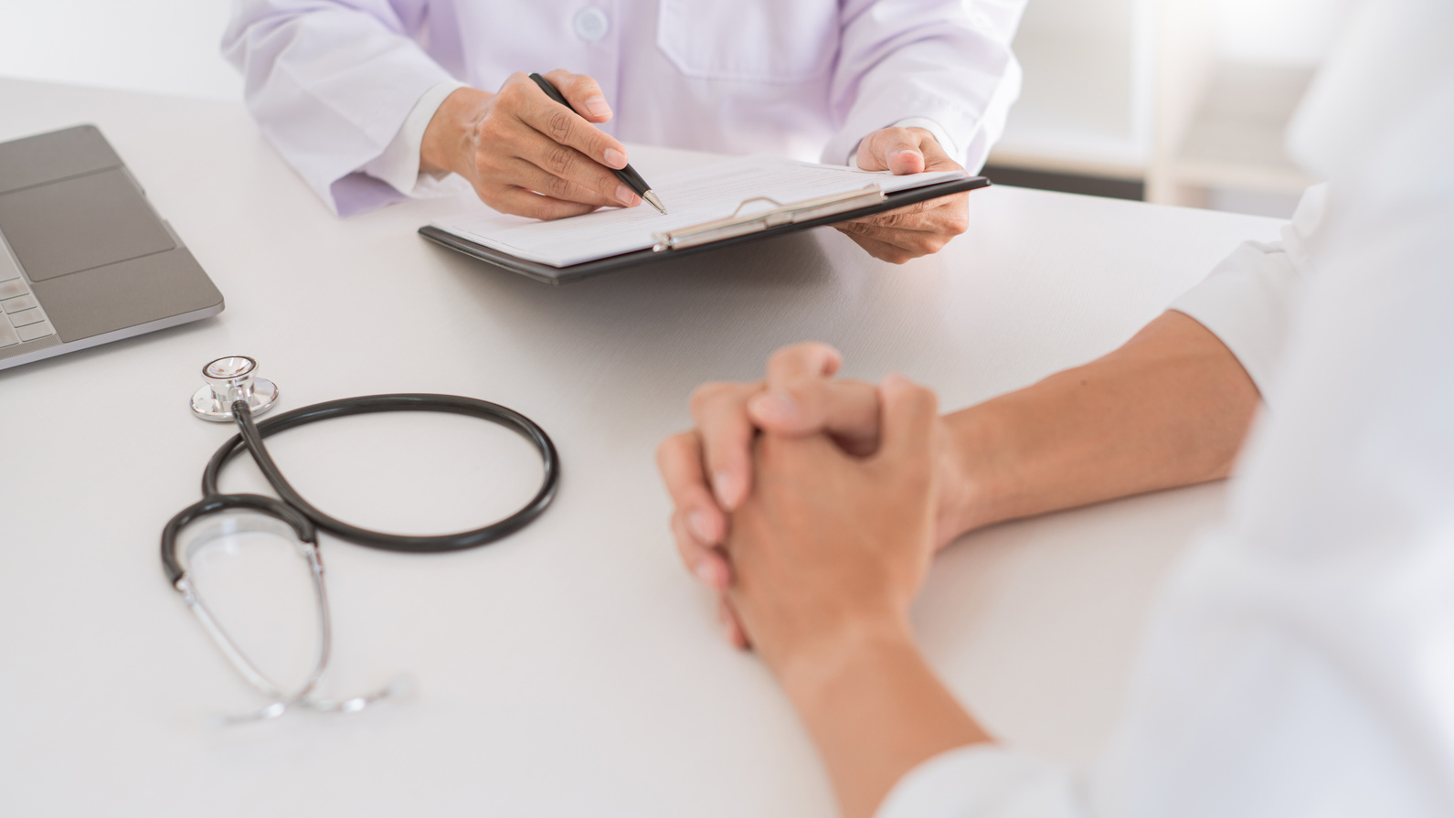 Patient Consulting with Primary Care Physician 